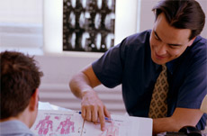 Chiropractor Talking to Patient